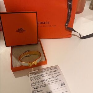 Hermes Gold and White Bracelet brand new never worn with recipe.